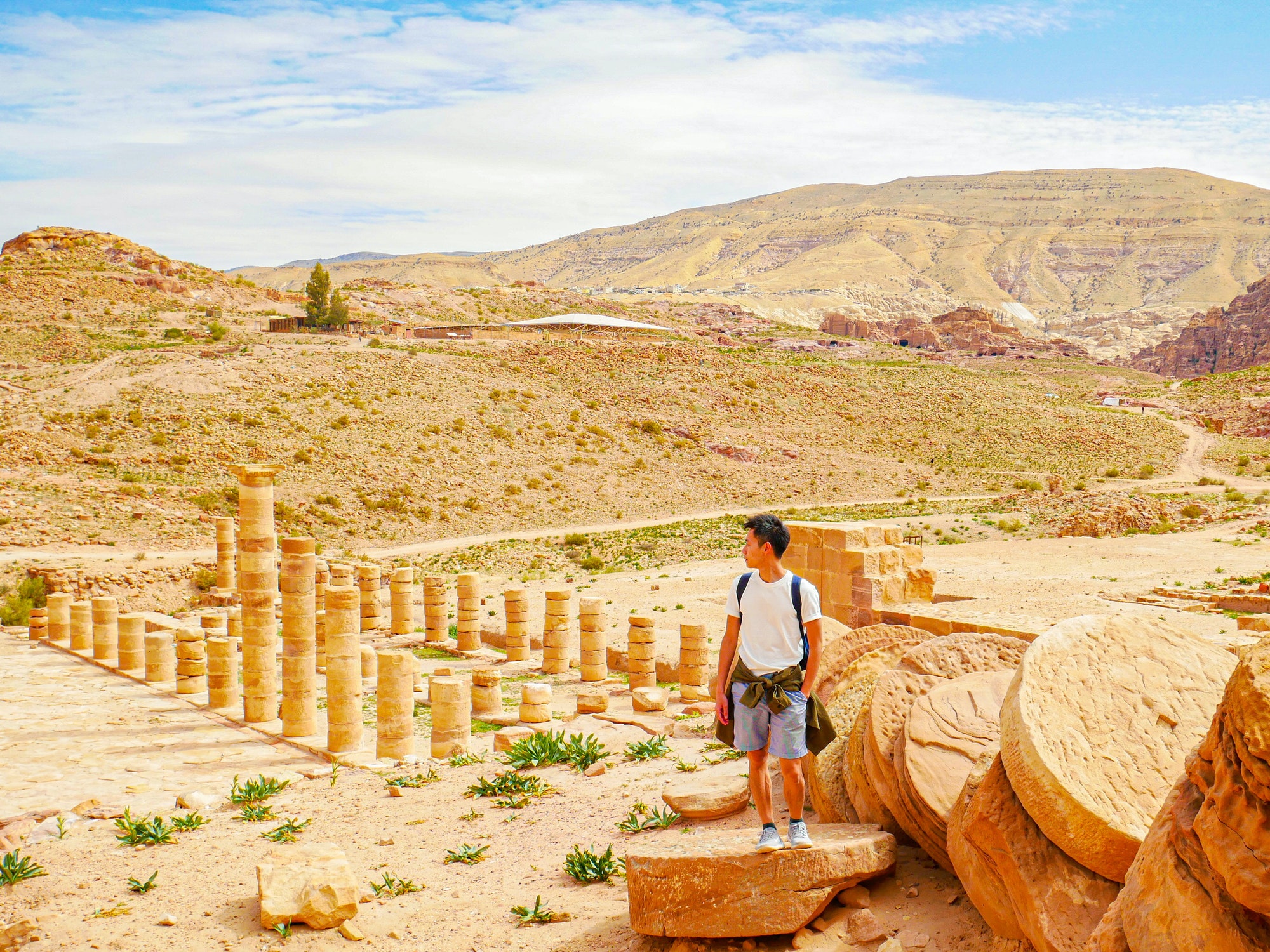 A traveler ( backpacker ) enjoying this beautiful landscape of the grand temple heritage