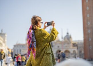 Woman traveling famous landmarks in Venice